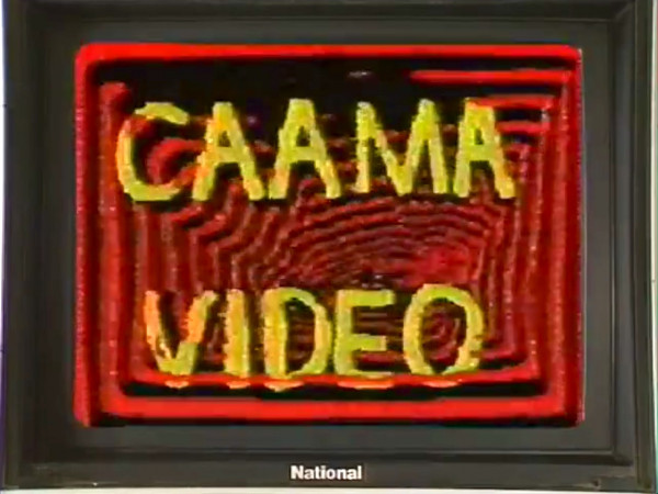 Yellow type on red background. Logo on CRT monitor screen. CAAMA VIDEO.