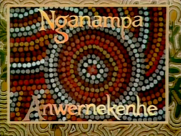 Screengrab. Bright logo. Patterned colours. Text reads Nganampa Anwernekenhe..