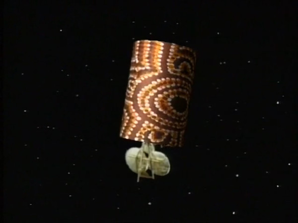 Computer generated image of satellite dish in brown and orange. Stars in the background.