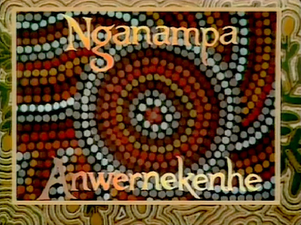 Screengrab. Bright logo. Patterned colours. Text reads Nganampa Anwernekenhe..